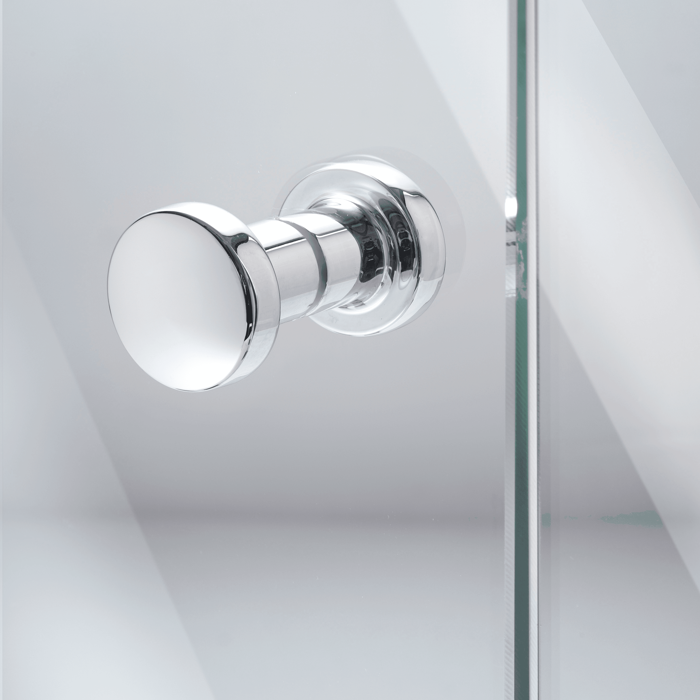 Shower door handle in chrome on a glass door